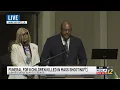 Commissioners Stormy Gage-Watts and Steffon Jones speaking at funeral