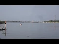 Самолет БЕ-200 набирает воду для тушения пожара в г. Дзержинке