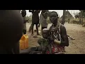 Toposa tribe woman breastfeeding her baby Namorunyang State Kapoeta South Sudan