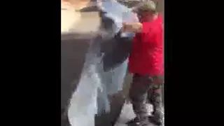 Asheville U-Haul moving help demo on folding moving pads by Clete Flanagan local guys moving