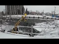 Excavator with a hoe ram attachment is breaking up rock to make way for the LRT tunnel Dec 11 2022