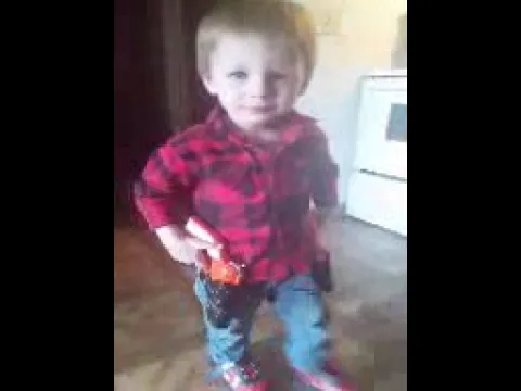 My grandson showing off his guns