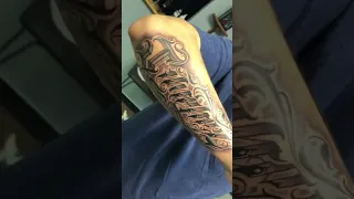Last name tattoo on the forearm
