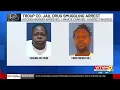 Troup County jail worker and inmate charged in contraband bust 1 sought