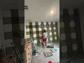 Painting a gingham buffalo accent wall for my nursery