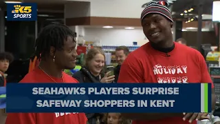 Seahawks players surprise shoppers at Kent Safeway pay for their groceries ahead of Thanksgiving