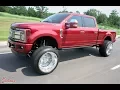 RUBY RED F250 Platinum running 26x16 Specialty s with a 6 inch lift
