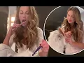 Kate Beckinsale dotes on her pet cat Willow as she brushes her teeth and combs her fur in amusing vi