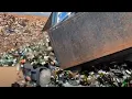 shows recyclables mixed with trash in DeKalb Co landfill