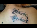 Names of children on upper back tattoo by Boris Kuryakin May 04 2018