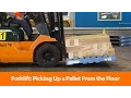 Forklift Picking Up A Pallet From The Floor - Safety Training