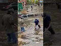 Heavy rain floods streets in New York City shattering rainfall records