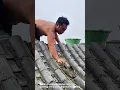 Construction worker laying tiles on roof- Good tools and machinery can increase work efficiency