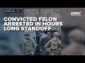 Suspect in hours long standoff fires at officers ends in arrest but no charges as of yet
