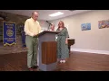 Debbie Petree passes rotary president gavel to Sharon Wilson
