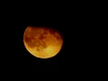 Download Lagu Moon rises red then disappears behind clouds