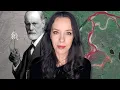 Miniaturka jednego z filmów Kai Kraski na YouTube. Jest przedstawiona pośrodku, zwrócona twarzą do widza. W tle po lewej stronie czarno-biały portret Zygmunta Freuda.