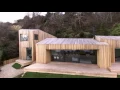 Download Lagu Four larch-clad volumes make up coastal holiday cabin by AR Design Studio