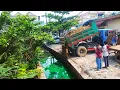 Download Lagu Complete Project Pushing rock to gross sewer and dirty water by bulldozer and tucks