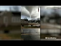Large tornado looms ominously overhead