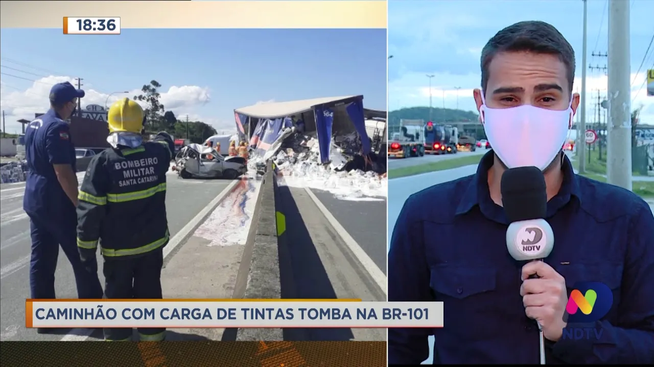 Caminhão com carga de tintas tomba na BR-101