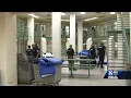 Guards searching prison cell by cell