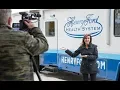 JoAnne Purtan from WOMC tours Henry All of Us mobile unit