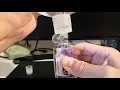 Refill small Purell hand sanitizer bottles without spilling or overflow from a large container