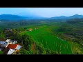 Download Lagu BAK LUKISAN NYATA, DESA DENGAN PEMANDANGAN SAWAH DAN GUNUNG