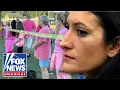 HUNDREDS rally in support of mom accused of murdering her children