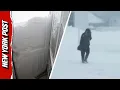 Record-breaking snowfall BURIES Michigan