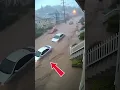 Flash Flood Sweeps Cars Down Suburban Street