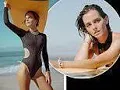 Emma Watson shows off her incredible figure in a cut-out black swimsuit