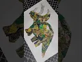 Making a dinosaur collage with magazine pieces
