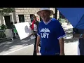 Coward UFT president hides under umbrella to avoid questions of teacher