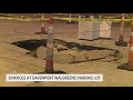 Sinkhole gapes open in Davenport Walgreens parking lot Wednesday