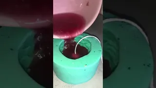 POURING HOT WAX INTO A MOLD