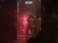 Legia Warsaw hooligans throw flare set police officer on fire