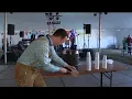 Meteorologist Sam Schreier taps Oktoberfest keg