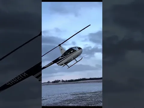 Why is this man holding the helicopter like this before starting it?