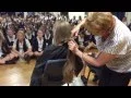 Getting a hair cut for World s Greatest Shave at school