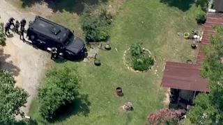 Armed suspect barricaded inside home