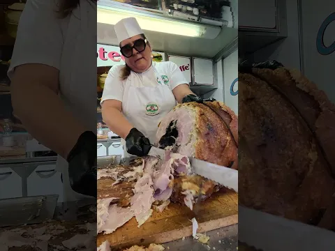 Slicing The Big Pork Roast. Italy Street Food Festival