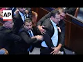 Two protesting lawmakers interrupt Trump s Knesset speech