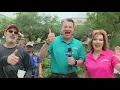 KENS 5 anchor and weather chief giving Fiesta medals away