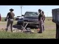 Altus Emergency responders work to free a accident victim pinned under a rolled over vehicle