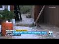Retaining wall in Palmdale falls during Tropical Storm Hilary floods nearby homes