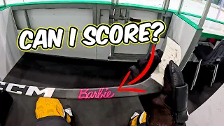 Trying to Score with a Barbie Hockey Stick