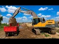 Volvo EC300DL Excavator Loading Dirt into Dump Truck Heavy Equipment in Action