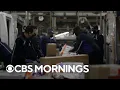 Norah O Donnell gets an exclusive look inside FedEx shipping facility